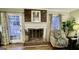 Living room fireplace with brick surround and mantel provides a cozy focal point at 365 Jordan Dr, Tucker, GA 30084