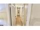 Bright hallway adorned with tastefully framed art, with wood flooring and white trim throughout at 365 Jordan Dr, Tucker, GA 30084