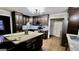 Modern kitchen showcasing dark wood cabinetry, stainless steel appliances, and an island with granite countertop at 365 Jordan Dr, Tucker, GA 30084