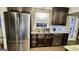 Stylish kitchen with stainless steel refrigerator, a tiled backsplash, and a modern sink at 365 Jordan Dr, Tucker, GA 30084
