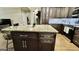 Kitchen island with dark wood cabinets and granite countertop, complementing the updated kitchen design at 365 Jordan Dr, Tucker, GA 30084