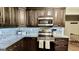 Updated kitchen featuring stainless steel appliances, granite countertops, and dark wood cabinetry at 365 Jordan Dr, Tucker, GA 30084