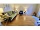 Inviting living room with stylish green sofa, blue chair, and hardwood floors at 365 Jordan Dr, Tucker, GA 30084