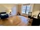 Bright living room featuring hardwood floors, a yoga mat, and a large window at 365 Jordan Dr, Tucker, GA 30084