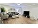 Bright living room boasts a leather couch and armchair at 365 Jordan Dr, Tucker, GA 30084
