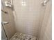 Tile shower featuring convenient built-in shelving, creating a stylish and functional bathing experience at 365 Jordan Dr, Tucker, GA 30084