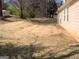 Large backyard with view of house, mature trees, and concrete patio at 4019 Pin Oak Trl, Decatur, GA 30034