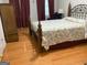 Bedroom featuring a queen bed, wood floors, and a wardrobe at 4019 Pin Oak Trl, Decatur, GA 30034