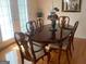 Formal dining room featuring a wooden table, ornate chairs, and natural light at 4019 Pin Oak Trl, Decatur, GA 30034