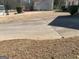A view of driveway and a well-manicured front yard at 4019 Pin Oak Trl, Decatur, GA 30034