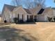 Charming single-story home with a well-manicured lawn and neutral-colored siding at 4019 Pin Oak Trl, Decatur, GA 30034