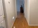Hallway leading to a living room with hardwood floors at 4019 Pin Oak Trl, Decatur, GA 30034