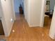 Hallway with hardwood flooring that leads to multiple rooms in the home at 4019 Pin Oak Trl, Decatur, GA 30034