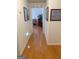 Hallway with hardwood floors leading to a living space with decor and furniture at 4019 Pin Oak Trl, Decatur, GA 30034