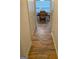 Hallway with wood floors leading to dining room with table and chairs at 4019 Pin Oak Trl, Decatur, GA 30034