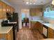 Traditional kitchen featuring light wood cabinets, recessed lighting, and modern appliances at 4019 Pin Oak Trl, Decatur, GA 30034