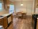 Eat-in kitchen area with hardwood floors and a dining table at 4019 Pin Oak Trl, Decatur, GA 30034