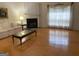 Open-concept living room with fireplace, hardwood floors, and ample space at 4019 Pin Oak Trl, Decatur, GA 30034