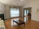 Light-filled living room with hardwood floors, fireplace, and dining area access at 4019 Pin Oak Trl, Decatur, GA 30034