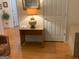 Living room with a floral patterned couch and desk, complemented by hardwood flooring at 4019 Pin Oak Trl, Decatur, GA 30034
