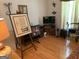Cozy living room with hardwood floors and filled with artwork, decor and a TV at 4019 Pin Oak Trl, Decatur, GA 30034