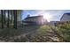 Backyard view featuring a large wooden deck with a fenced in yard and mature trees at 220 Joe Dr, Temple, GA 30179