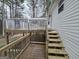 Wooden deck showcasing a split-level design with access to the yard and house at 220 Joe Dr, Temple, GA 30179