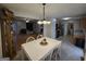 Open dining area showcasing an adjacent living room and stainless steel appliances at 220 Joe Dr, Temple, GA 30179
