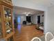 Open-concept living room featuring hardwood floors, a ceiling fan, and neutral paint scheme at 220 Joe Dr, Temple, GA 30179