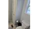 Powder room with toilet, and small trash receptacle at 220 Joe Dr, Temple, GA 30179