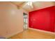 Bedroom featuring hardwood floors, a ceiling fan, and an accent wall at 318 Turner Cir, Mcdonough, GA 30252