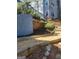 Landscaped backyard with gravel walkways and retaining walls, adding visual appeal at 718 Avalon Way, Peachtree City, GA 30269