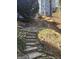 Stone steps leading to the backyard, with a view of the house and trees at 718 Avalon Way, Peachtree City, GA 30269