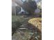 Natural stone steps in the backyard, with garden features at 718 Avalon Way, Peachtree City, GA 30269