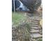 View of the house and backyard area, featuring landscaping and stone pathways at 718 Avalon Way, Peachtree City, GA 30269