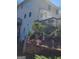 View of the house's exterior, highlighting the deck and landscaped backyard at 718 Avalon Way, Peachtree City, GA 30269