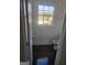Bathroom featuring white wainscoting and trim, a large window, and modern fixtures at 718 Avalon Way, Peachtree City, GA 30269