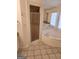 Bathroom featuring tile floors, a corner soaking tub, and a glass enclosed shower with granite countertops at 718 Avalon Way, Peachtree City, GA 30269