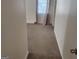 Bedroom with neutral carpeting, a window, and an open door at 718 Avalon Way, Peachtree City, GA 30269
