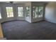 Spacious bedroom featuring multiple windows offering an abundance of natural light and neutral carpeting at 718 Avalon Way, Peachtree City, GA 30269