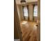 Bedroom featuring hardwood floors, natural light, and standard light fixture at 718 Avalon Way, Peachtree City, GA 30269