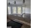 Bright dining room with large windows and patterned wallpaper for a modern aesthetic at 718 Avalon Way, Peachtree City, GA 30269