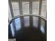 A dining room featuring dark wood floors and large bay windows at 718 Avalon Way, Peachtree City, GA 30269
