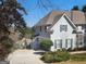 Charming home exterior features a two-car garage and a covered front porch entrance at 718 Avalon Way, Peachtree City, GA 30269
