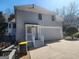 Charming home exterior features a two-car garage and a covered front porch entrance at 718 Avalon Way, Peachtree City, GA 30269