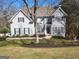 Stunning traditional-style home boasts pristine landscaping, dark shutters, and stone accents at 718 Avalon Way, Peachtree City, GA 30269