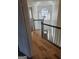 Hallway features hardwood flooring, railing, and a decorative chandelier at 718 Avalon Way, Peachtree City, GA 30269