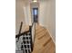 Upstairs hallway features hardwood flooring and a black and white railing at 718 Avalon Way, Peachtree City, GA 30269