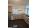 Well-equipped kitchen features granite countertops, stainless steel appliances, and light wood cabinets at 718 Avalon Way, Peachtree City, GA 30269