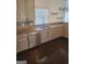 Well-lit kitchen features stainless steel appliances, granite countertops, and a sink with a window view at 718 Avalon Way, Peachtree City, GA 30269